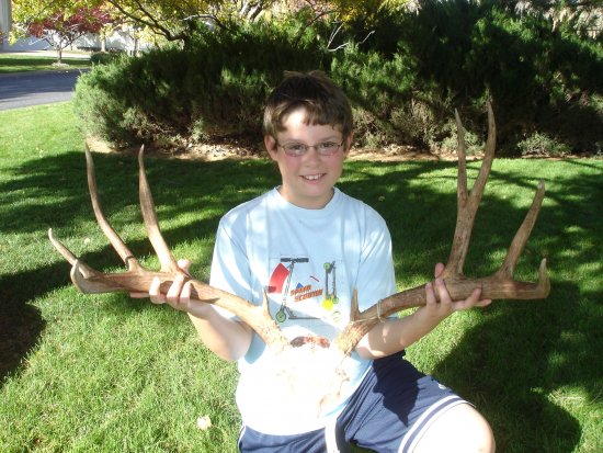 Dallen showing off the 30 inch rack of the buck he spotted with me