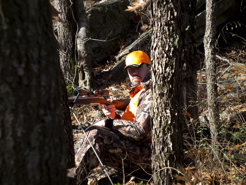 Deer Hunter With Shooting Sticks and Mossy Oak Break-Up Infinity