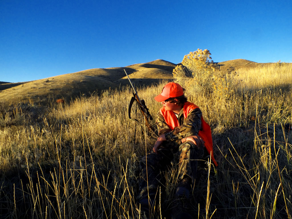 Dallen sitting on ridge looking for mule deer