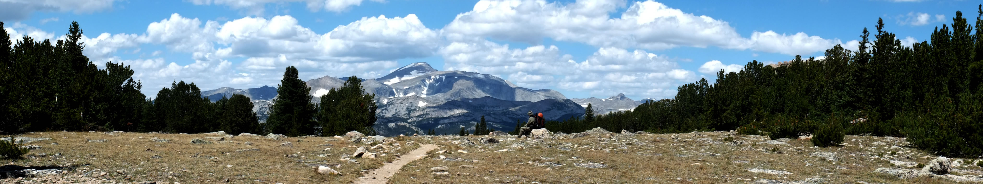Panorama of going over the pass with the Wind River Peak in the background.