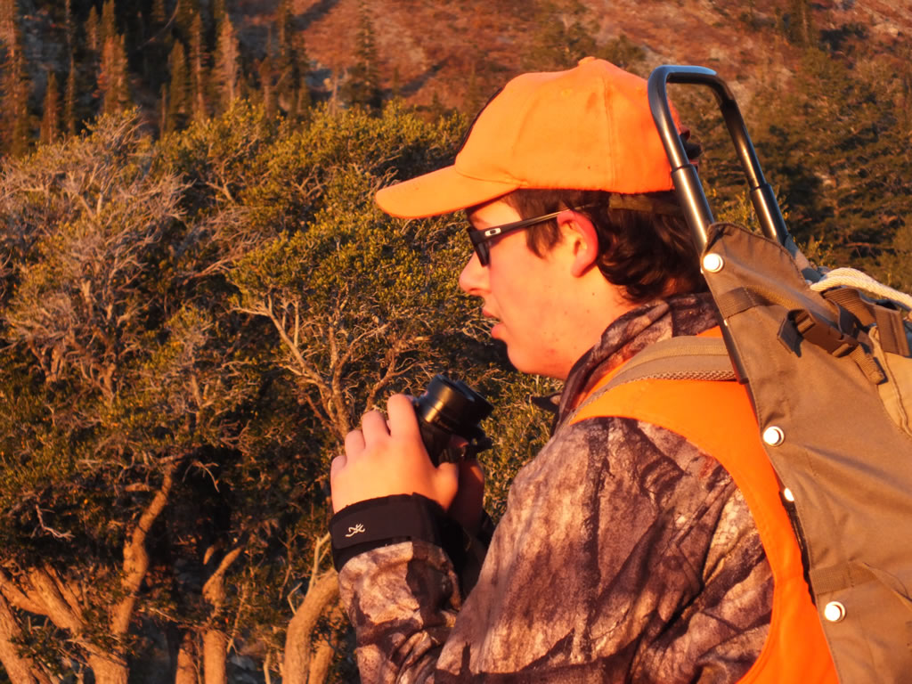 Dallen glassing for elk carrying an Alps Commander pack